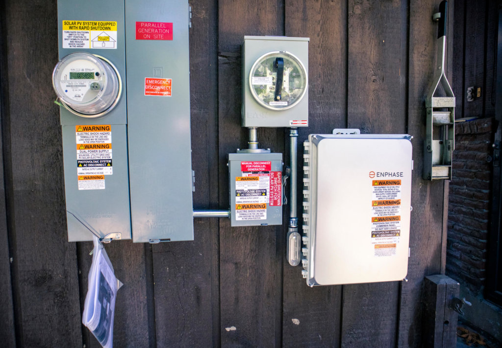 Electrical meter and panels installed on exterior of house