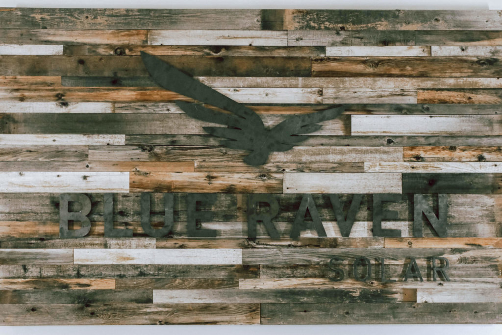 Blue Raven Solar logo mounted to reclaimed wood