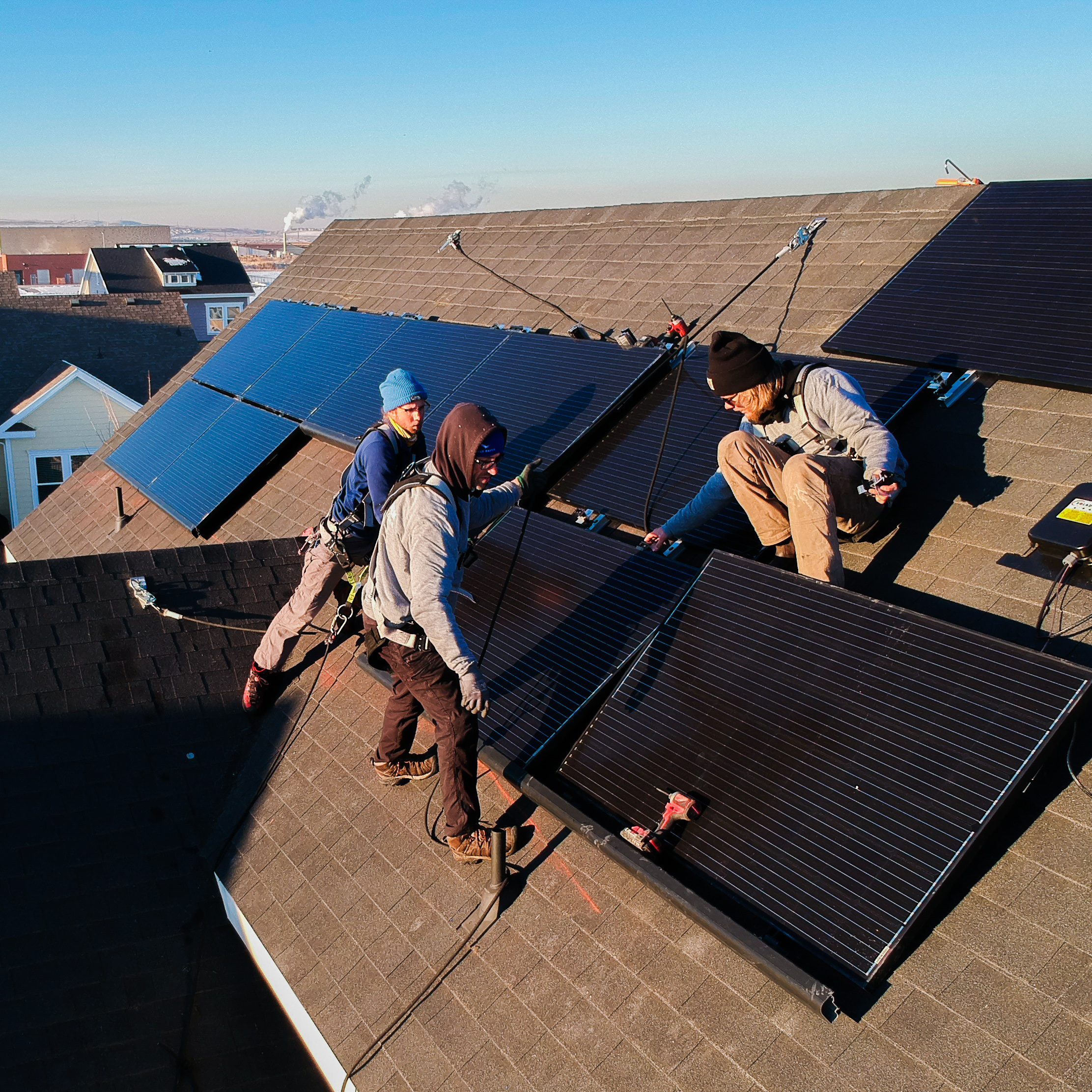 men installing solar panels