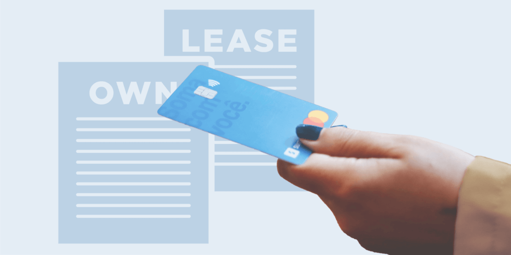 Hand holding a credit card with 'Own' and 'Lease' documents in the background