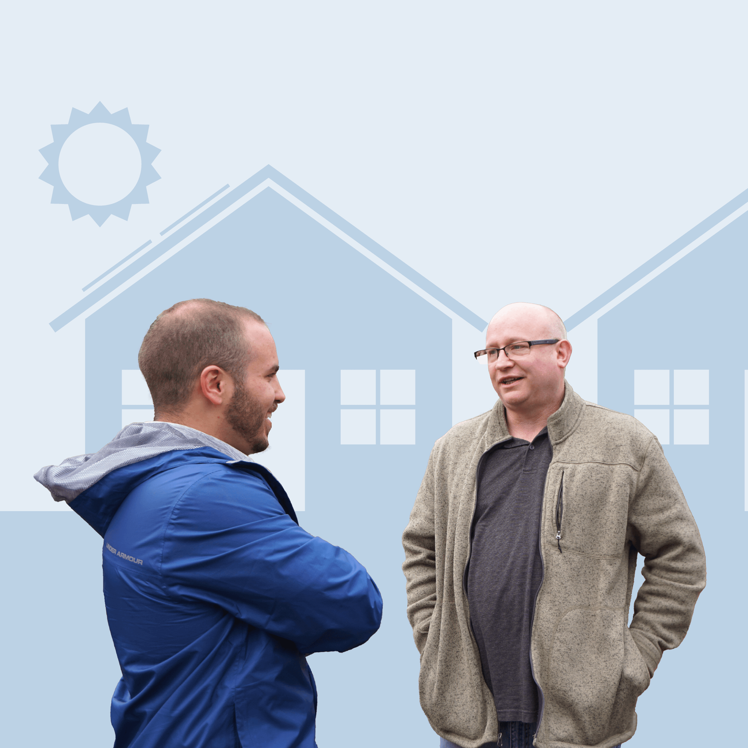 Two males standing and talking in front of two house graphics