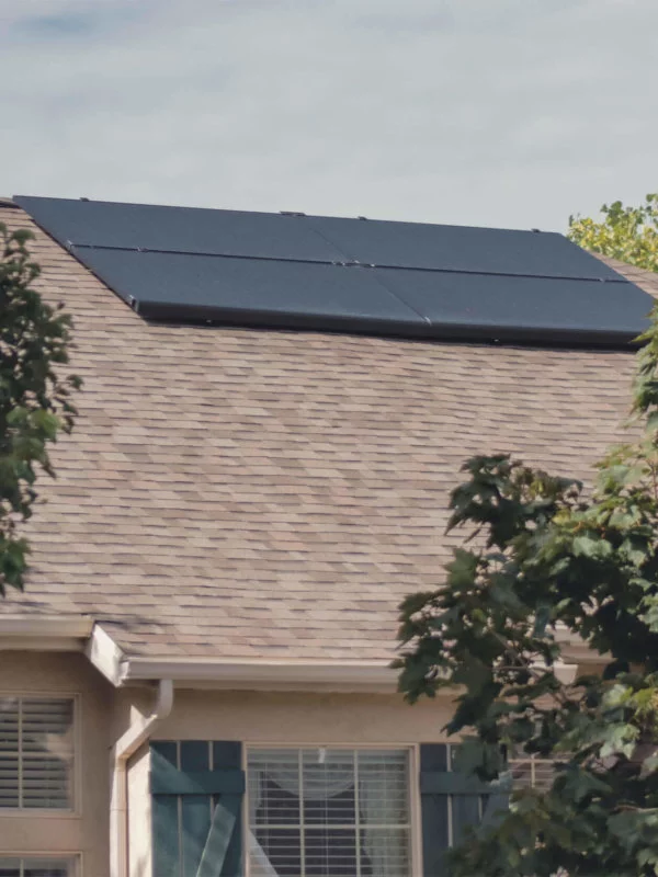 Four solar panels installed, together, on a singlle level house