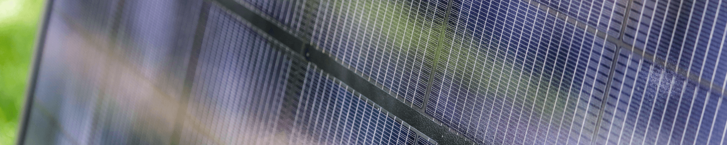 Up close shot of a solar panel, featuring individual solar cells