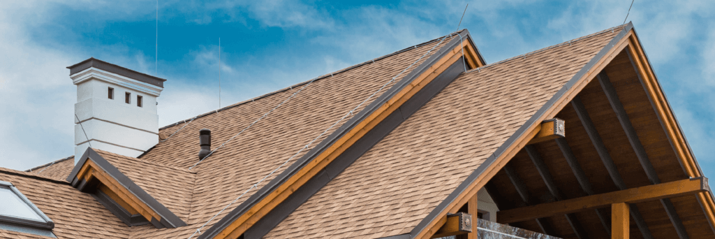 Traditional shingle roof line with different pitches in varigated brown tones