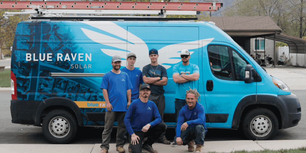 How Does a Home Solar System Work-03 Six Blue Raven Solar installers standing in front of a branded van in preparation for system install