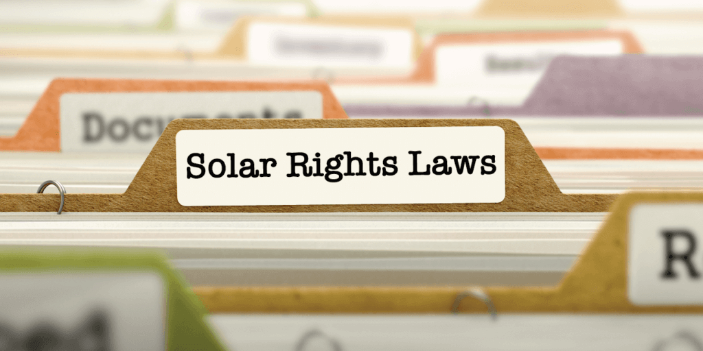 File folders with different labels, one indicating "Solar Rights Laws" in typewriter font