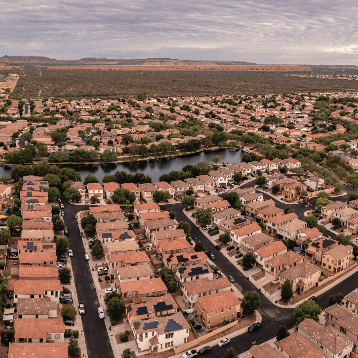 Aerial view of dense neighborhoods with a body of water in the middle