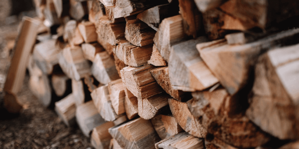Different sized pieces of wood stacked into a wall
