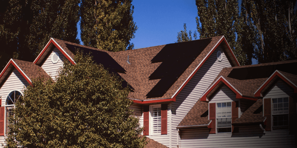 Multi-level house with large solar panel system installed on multiple roof planes